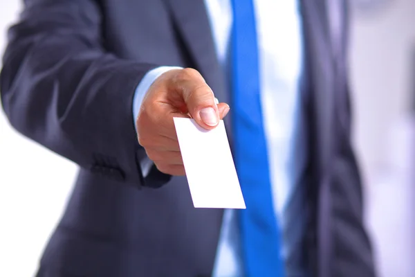 Creative businessman holding out his business card — стоковое фото