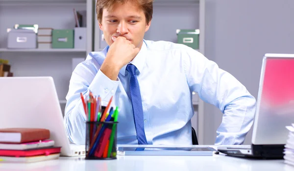 Businessman working at a desk computer graphics — Stock Photo, Image