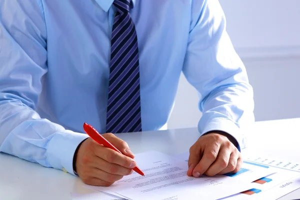 Businessman working at a desk computer graphics — Stock Photo, Image