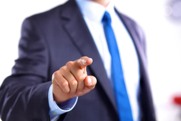 Joven hombre de negocios señala con el dedo un objeto — Foto de Stock