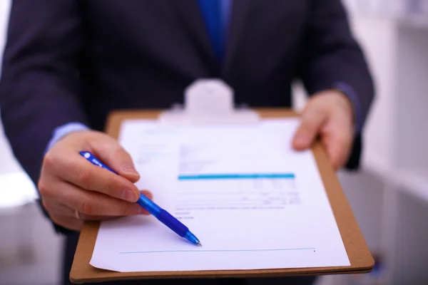 Businessman holding a blank white board — Stock Photo, Image