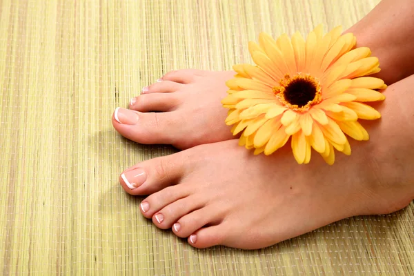 Pedicure on legs and beautiful manicure hands closeup Stock Photo