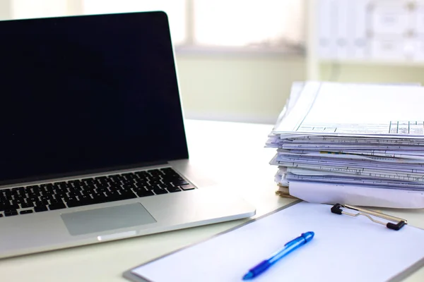 office desk a stack of computer paper reports work forms