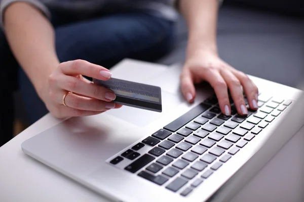 Businesswoman using his credit card for an online transaction,Businessman using his credit card for an online transaction — Stock Photo, Image