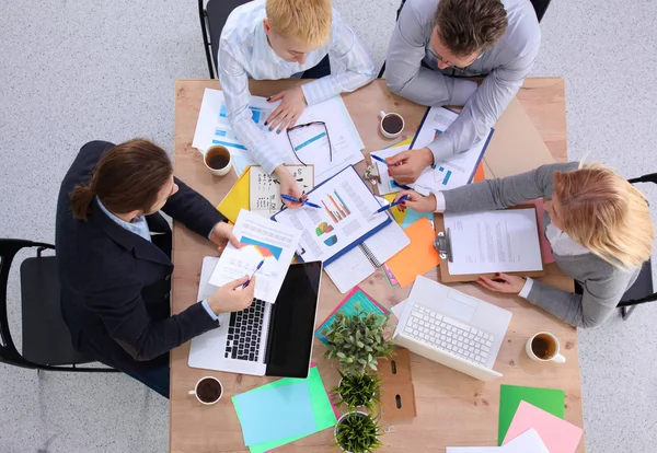 stock image Image of business partners discussing documents and ideas at meeting