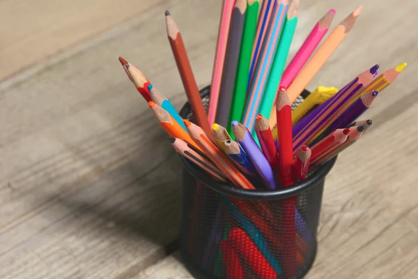 Book and pencil on old wooden table — Stock Photo, Image