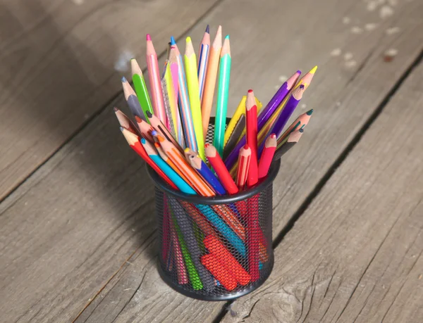 Book and pencil on old wooden table — Stock Photo, Image