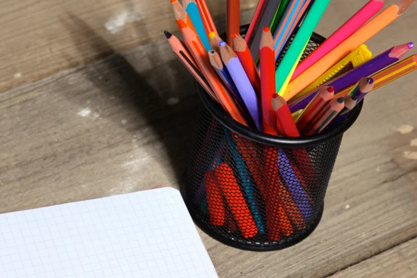 Book and pencil on old wooden table — Stock Photo, Image