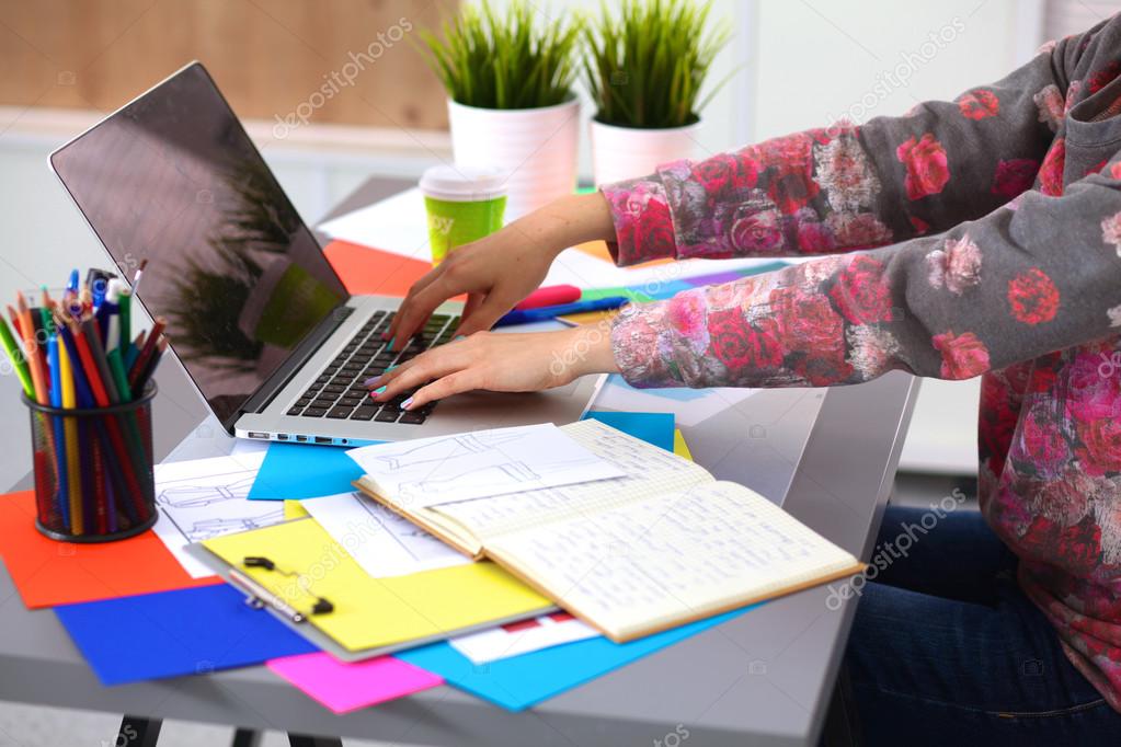 Designer working at desk using digitizer in his office