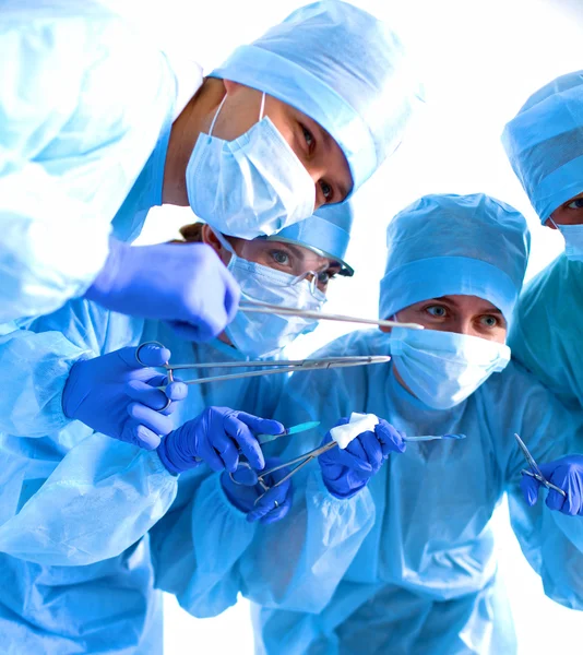 Team of surgeon in uniform perform operation on a patient at cardiac surgery clinic — Stock Photo, Image