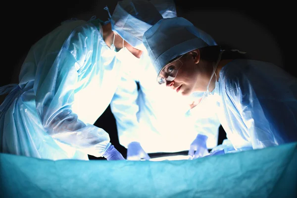 Team surgeon at work in operating room — Stock Photo, Image