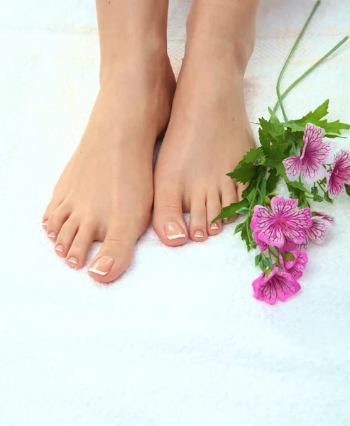 Closeup photo of a beautiful female feet with pedicure — Stock Photo, Image