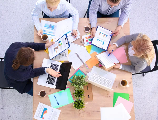 Image of business partners discussing documents and ideas at meeting — Stock Photo, Image