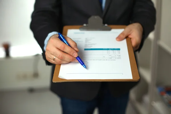 File folders, standing on  shelves in the background — Stock Photo, Image