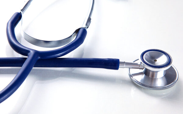 Stethoscope on white table with shallow depth of field for medical college concept