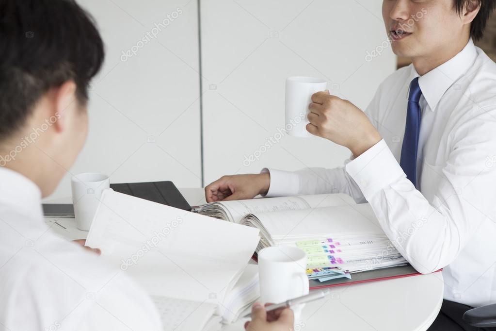 Businessmen discussing in conference room