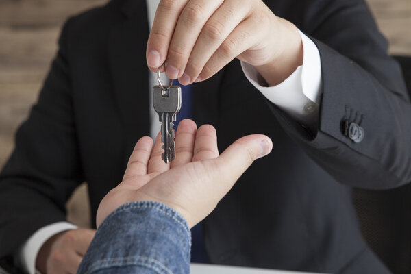 Happy man with real estate agent