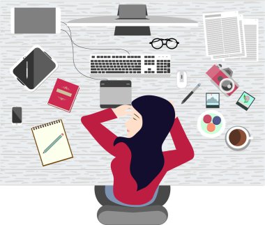 A woman taking a nap on working table. clipart