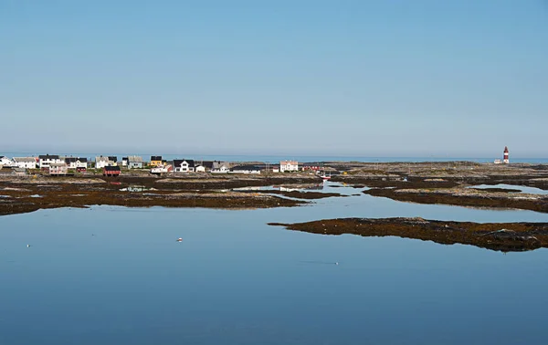 Veiholmen,an island on the west coast of Norway. Haugjela light house. Beautiful blue sky. Blue sea.