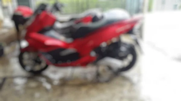 Elvont Disszidált Homályos Háttér Piros Motorkerékpár Garázsban — Stock Fotó