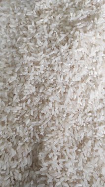 Beyaz pirinç taneciklerinin arka plan fotoğrafı.