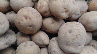 Background photo of a pile of potatoes sold at the Cikancung market