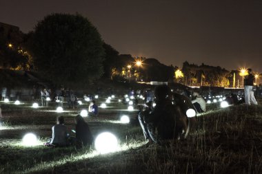 Circus Maximus illuminated by glowing balls clipart