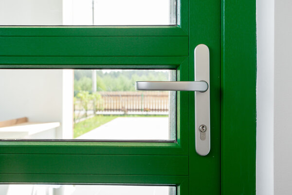 Green door with metallic handle