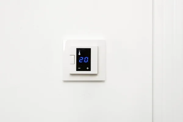 Digital climate control on white wall — Stock Photo, Image
