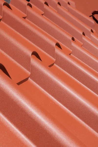 Red metal tile close-up