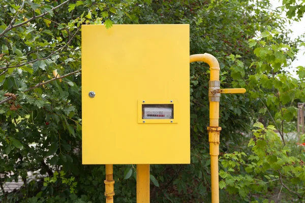 Pipes and gas-meter on nature background — Stock Image Pipes and gas-meter on nature background Royalty Free Stock Photos