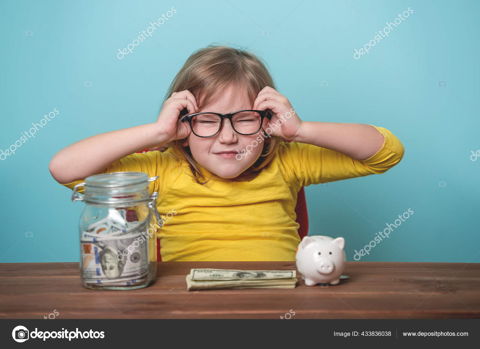 Funny Child Girl Glasses Saving Money Jar Piggy Bank Blue Stock Photo by  ©Sharomka 433836038