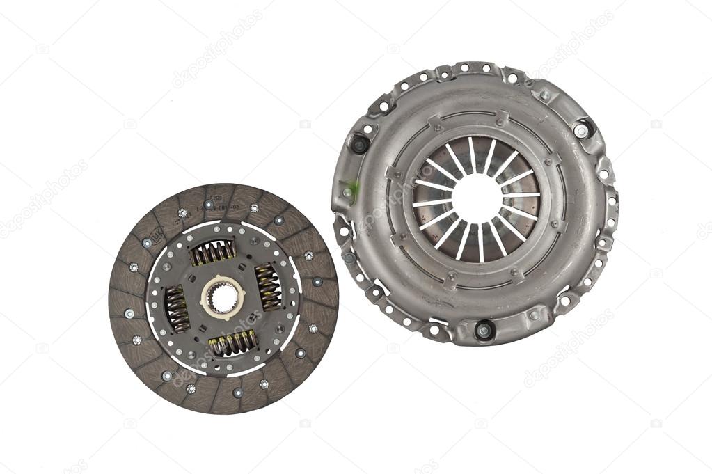 A new set of replacement automotive clutch on a white. Disc and clutch