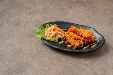 Balık kroket ya da morina balığı gibi morina balığından yapılmış balık kroket. Genellikle tartar sosu, kokteyl sosu ya da ketçap ile yenirler..