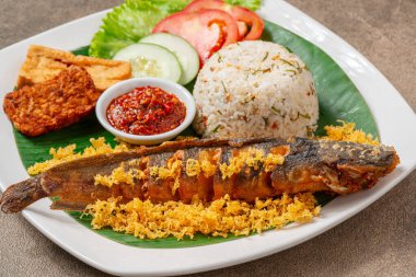 Fried Catfish (Indonesia : lele goreng) with sambal balado is Traditional Indonesian Culinary Food, Popular Street Food Called Pecel Lele Lamongan or Penyetan Lele.