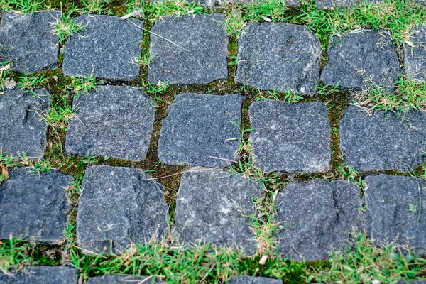 背景に古い天然石の壁 古代の石積みのレンガの壁 豊かで多様な質感のフルフレームが閉じられます — ストック写真