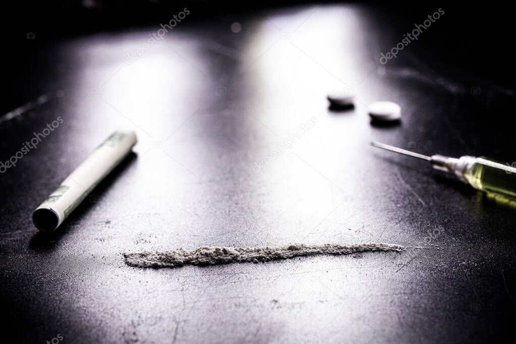row or row of cocaine, illegal drugs in a dark setting, 