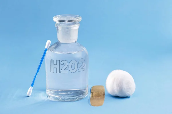 Reagent bottle with glass stopper, with hydrogen peroxide inside. Chemical element H2 O2 in laboratory