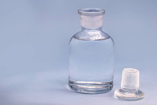Reagent bottle with description: Sulfuric acid. a mineral acid composed of the elements sulfur, oxygen and hydrogen with the molecular formula HS2O4