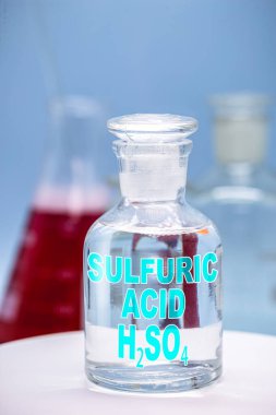 Reagent bottle in laboratory with description: Sulfuric acid. clipart