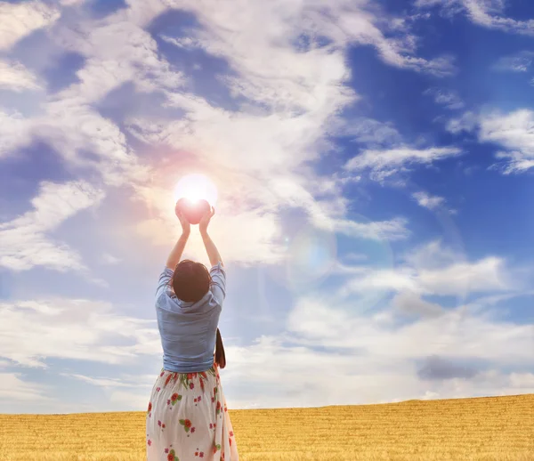 Women rare or back view gently raise red heart to puffy clouds b