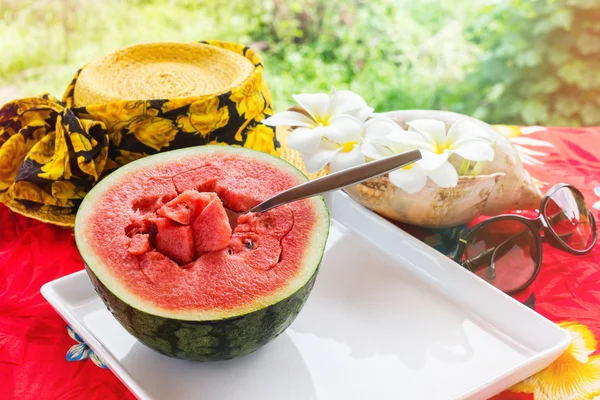 Half fresh and red watermelon fruit and spoon on white tray — Stock Photo, Image