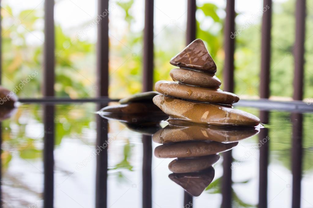 Pebble on water in zen style background