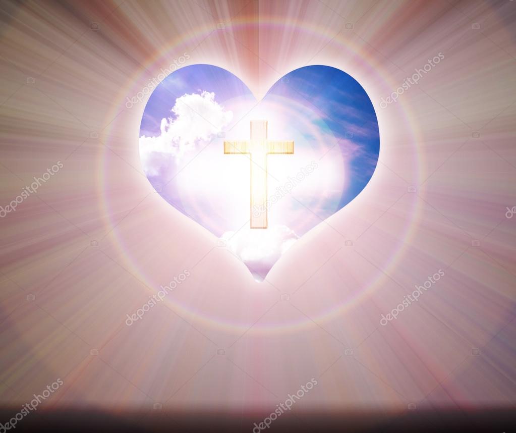 Crucifix and light on heart background  
