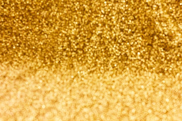 Brilho espátula ouro bokeh fundo de luz — Fotografia de Stock
