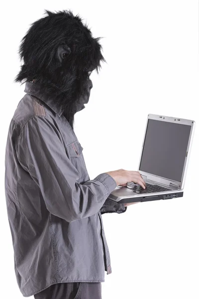 Man with gorilla mask working — Stock Photo, Image