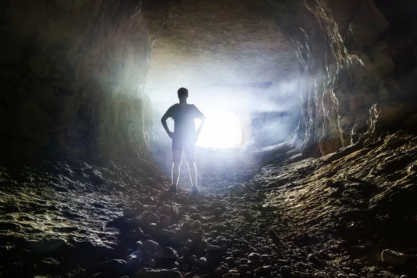 Man in cave — Stock Photo, Image