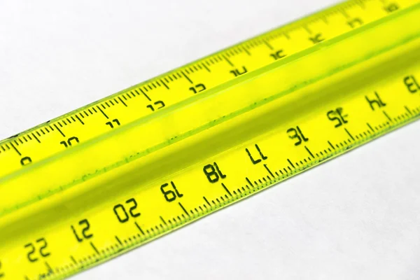 Yellow plastic ruler — Stock Photo, Image