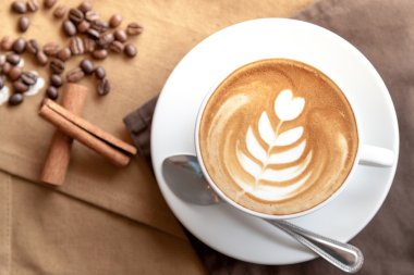 A cup of coffee with good latte art clipart
