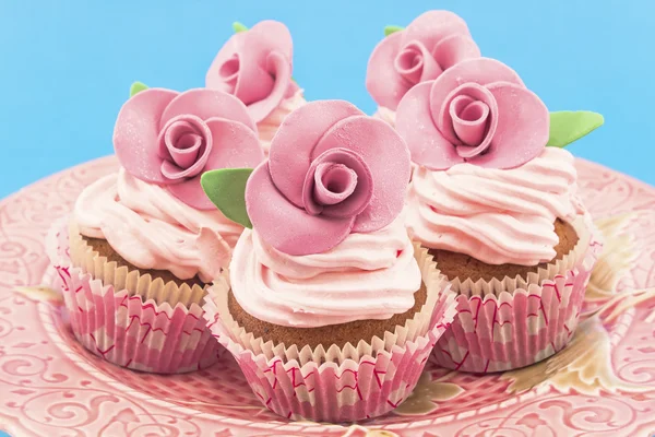 Vintage cupcakes on a blue background — Stock Photo, Image